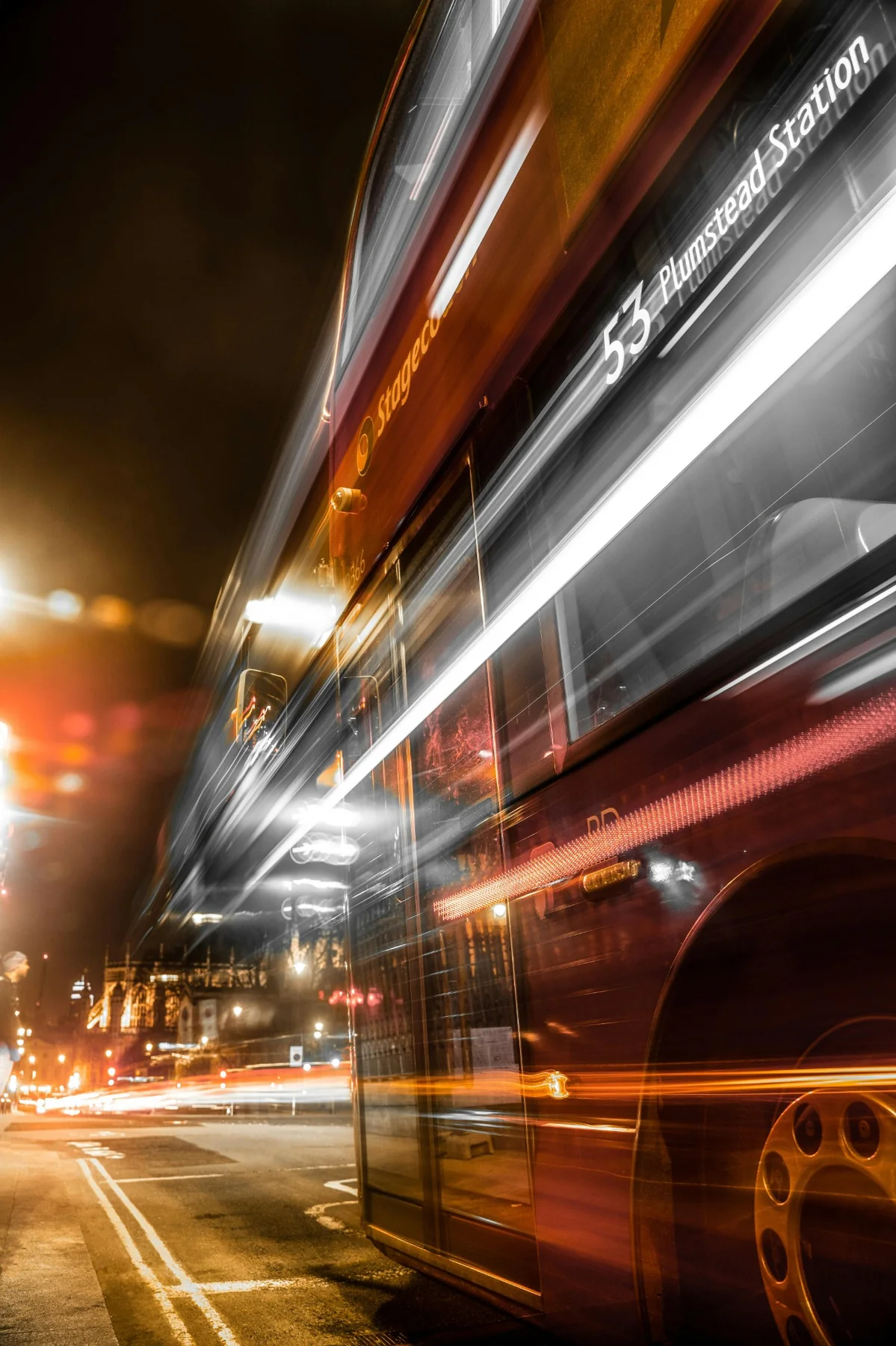 London at night with movement across the city