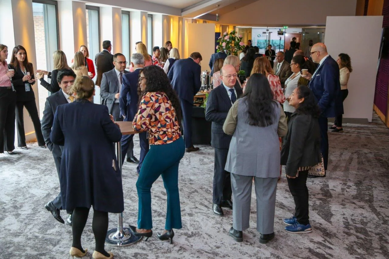 International professional leaders in conversation at a previous global gathering