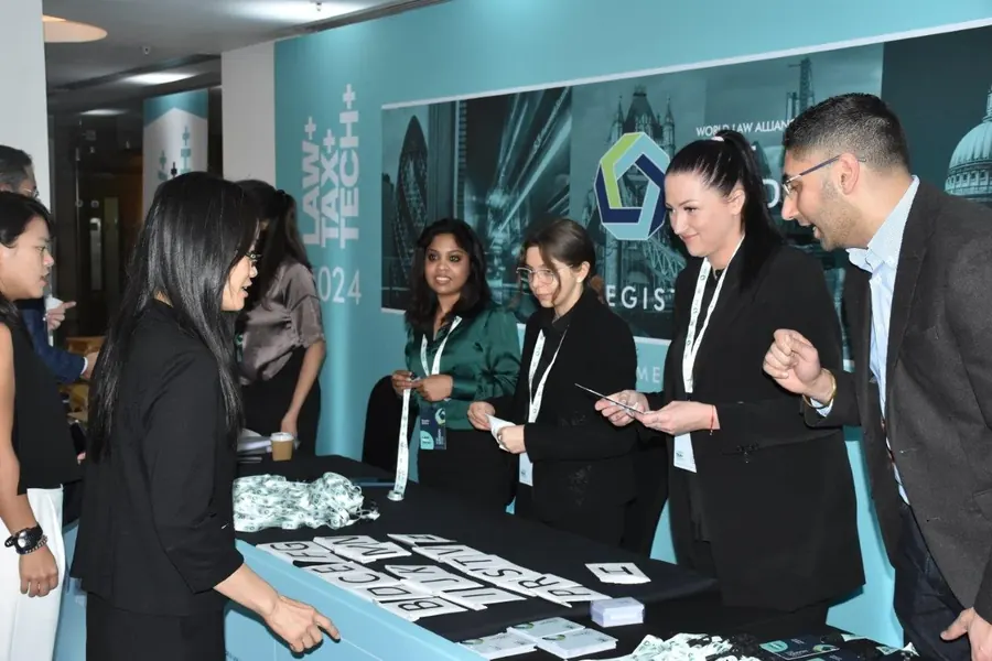 Delegates at the registration desk of an Assembly