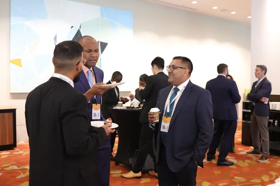 Delegates talking over coffee at a WONE Global event